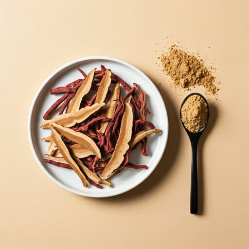 Sliced dried Ganoderma with powder on a white plate